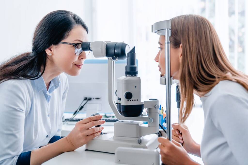 Ophthalmologist doctor visits woman eye