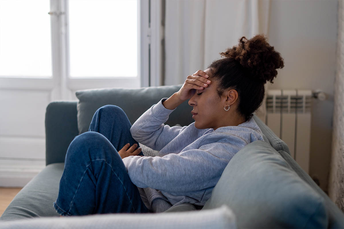 girl sitting sofa sad depression stress