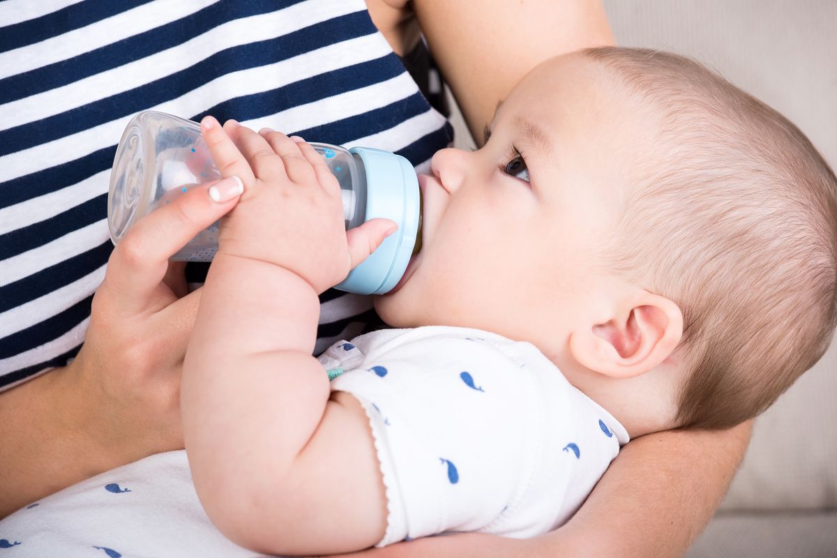 baby bottle feeding mom