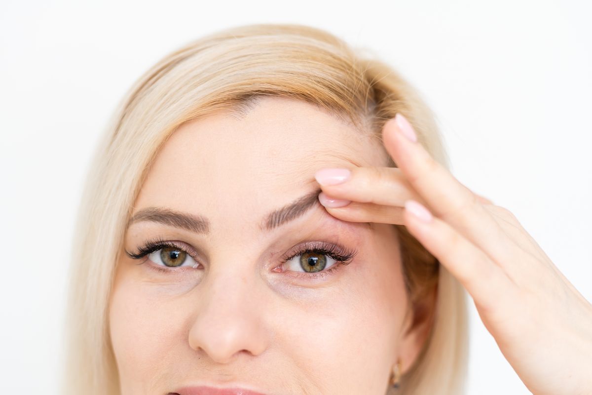 woman headache eyebrows