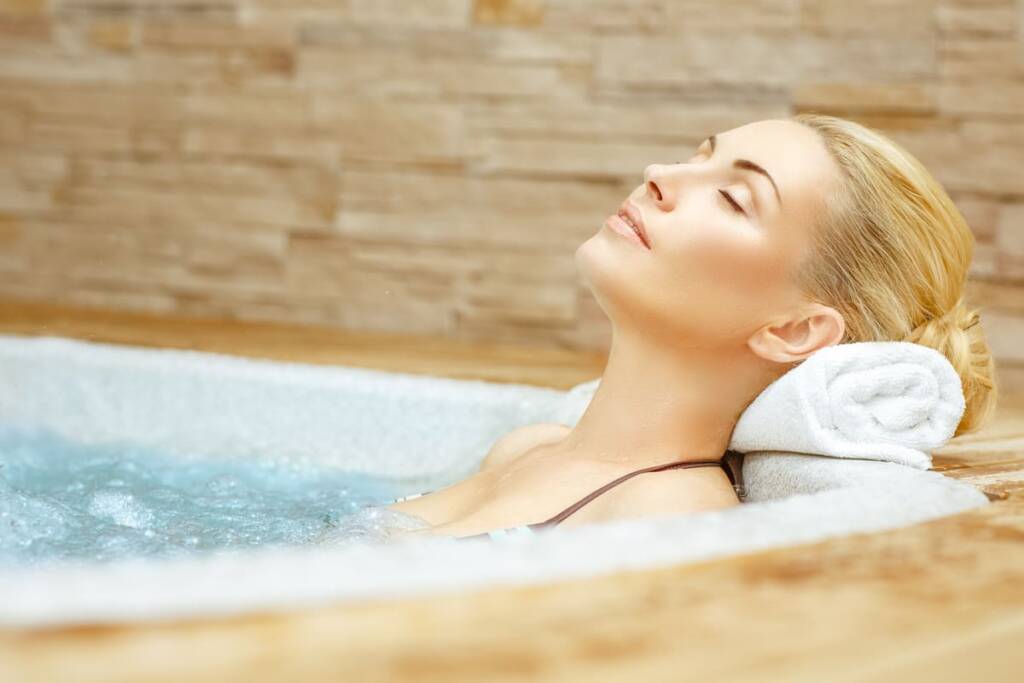 whirlpool tub relaxed woman