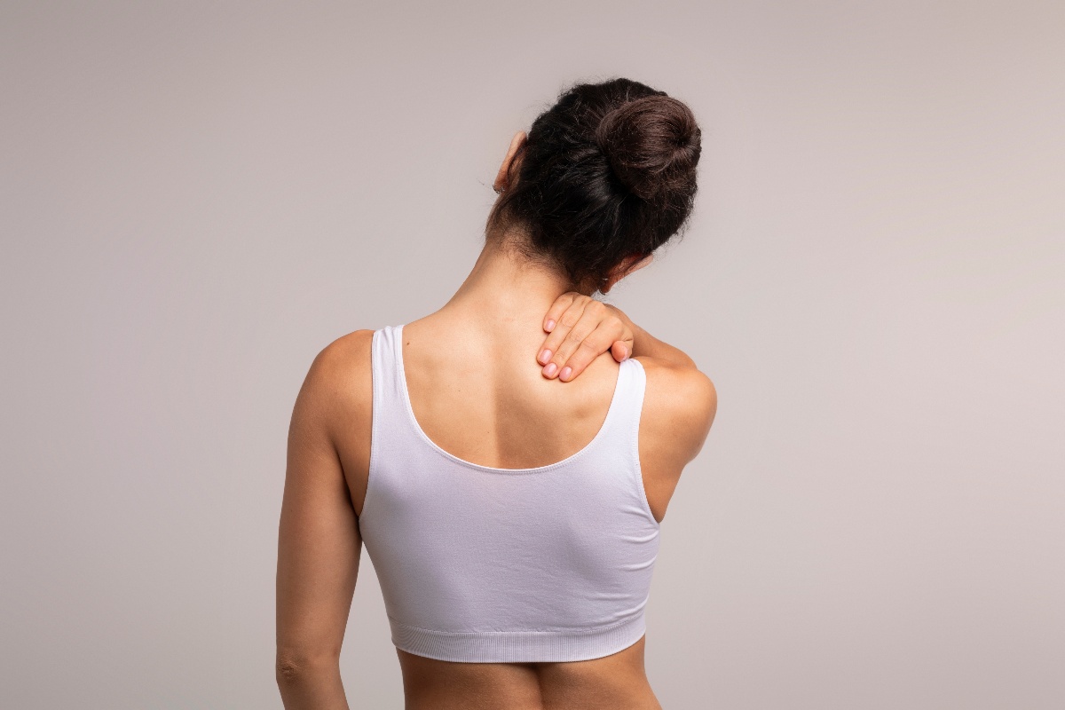 Woman with neck muscle pain